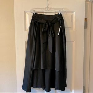 Elle High Low Satiny Skirt With Attached Bow